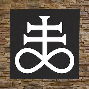 Könnte beinhalten: Ein weißes Symbol auf schwarzem Hintergrund. Das Symbol ist ein Kreuz mit einem Kreis am unteren Ende, der ein Unendlichkeitszeichen bildet.