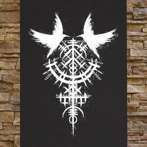 May include: A black and white graphic design featuring two stylized birds with wings spread wide, facing each other. The birds are centered around a circular symbol with intricate details and runes. The design is reminiscent of a mystical or spiritual symbol.