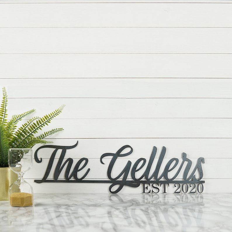 Personalized family name sign made from durable metal, customized with your last name and established date to celebrate a wedding, new home, anniversary or any meaningful milestone.