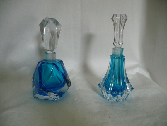 Two blue tinted glass perfume bottles Two blue tinted glass perfume bottles