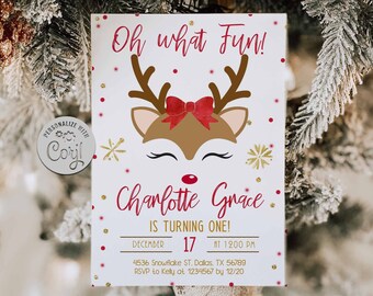 May include: A festive invitation with a reindeer design. The card features a reindeer face with antlers and a red bow, along with the text "Oh what Fun!" and "Charlotte Grace is turning one!" The date is December 17.