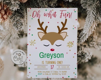 May include: A white invitation card with a reindeer design and the text "Oh what Fun!" in red. The card includes the name "Greyson" in green, the date December 17, and other event details. Festive gold, red, and green accents are scattered around the design.