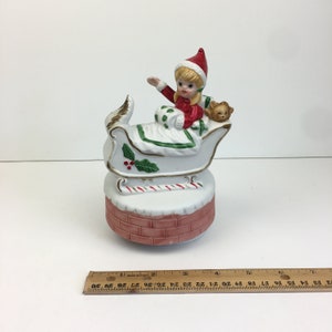 Vtg Christmas Holiday Musical Figurine Girl Santa Outfit Sleigh Sled Ceramic