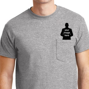May include: A heather gray t-shirt with a pocket on the left side. The pocket has a black silhouette of a person with the text "your image here" inside.