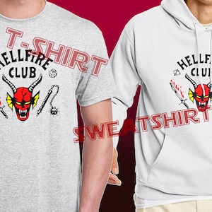 May include: A gray t-shirt and a white sweatshirt with a red demon graphic and the text "Hellfire Club".