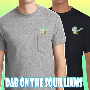 May include: Two t-shirts with a pocket on the front. The left shirt is grey and the right shirt is black. Both shirts feature a cartoon image of Squidward from Spongebob Squarepants doing the dab in the pocket. The text "Dab on the Squilliams" is at the bottom of the image.