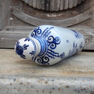 vintage white and blue  hand painted bottle with handle