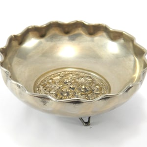 Vintage silver plated bowl with floral decoration.