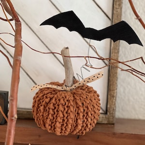 Crocheted stuffed pumpkin with driftwood stem and floating leather bat, vintage Halloween, harvest, primitive Halloween