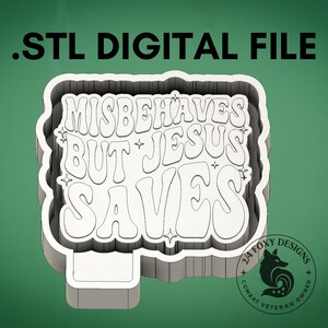 May include: A white and gray .STL digital file with the text "MISBEHAVES BUT JESUS SAVES" in a layered design. The image includes a logo with a fox and the words "2/4 Foxy Designs" and "Combat Veteran Owned".