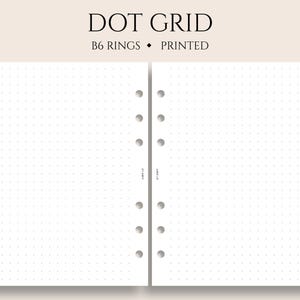 May include: Two white pages with a dotted grid pattern. The pages are punched for a ring binder and have the text "DOT GRID" and "B6 RINGS • PRINTED" at the top.