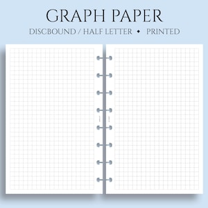 May include: A white, discbound notebook with graph paper. The notebook is open to show the spiral binding and the graph paper inside. The text "GRAPH PAPER" is printed at the top of the notebook, and the text "DISCBOUND / HALF LETTER * PRINTED" is printed below the title.