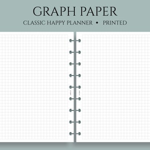 May include: A white graph paper notebook with a black spiral binding. The notebook is open to two blank pages with a grid pattern.