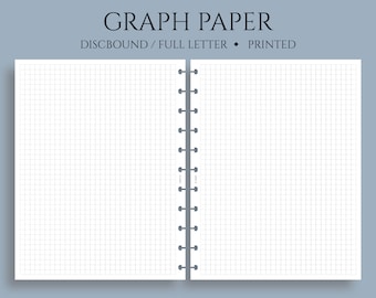 May include: A white, discbound graph paper notebook with a full letter size page. The notebook has a spiral binding and is printed with a grid pattern.