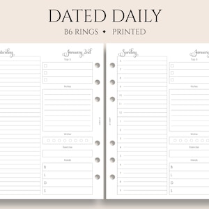 May include: A dated daily planner insert with the text "DATED DAILY" at the top. The planner pages are white with black text and lines, featuring sections for time slots, notes, water intake, exercise, and meals. The planner is designed for B6 rings and is printed.