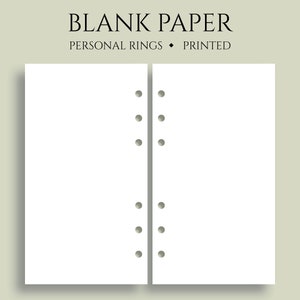May include: Two blank white pages with six evenly spaced holes down the side of each page. The pages are for a personal size ring binder.