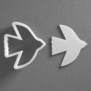 Gestileerde vogelkoekjesvormer en dierenvleugels Oorbel van polymeerklei, aardewerkgereedschap