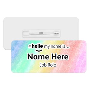 May include: A colourful rainbow watercolour name tag with a pin on the back. The tag says "#hello my name is... Name Here Job Role".