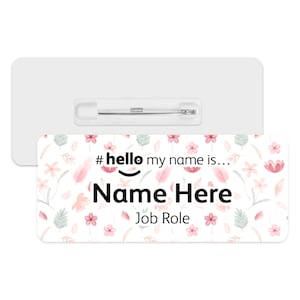 May include: White name tag with a floral pattern and the text "#hello my name is... Name Here Job Role".