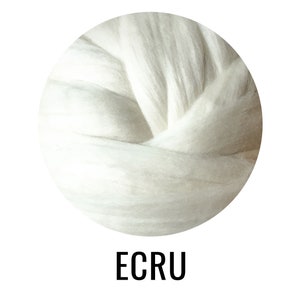 May include: A close-up of a ball of ecru wool roving. The wool is soft and fluffy, and it is perfect for spinning or felting.