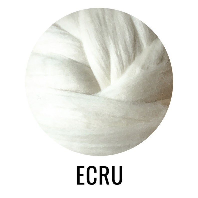 May include: A close-up of a ball of ecru wool roving. The wool is soft and fluffy, and it is perfect for spinning or felting.