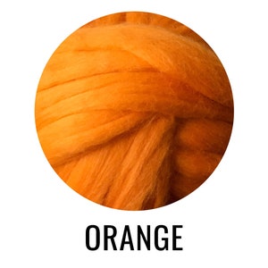 May include: A close-up of a ball of orange wool fiber. The wool is soft and fluffy, and it is perfect for crafting.