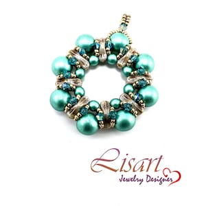 May include: A teal and gold beaded pendant with a circular design. The pendant is made with small round beads and has a delicate, intricate look.