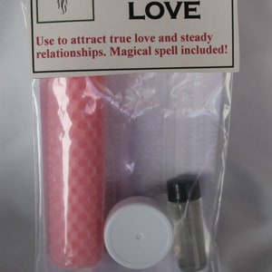 May include: A clear plastic bag containing a pink candle, a white-lidded container, and a small glass vial with a black cap. The bag has a label that reads "Power Within Magical Spell Kit LOVE."