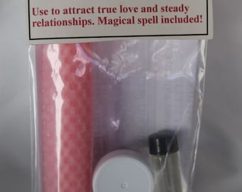 May include: A clear plastic bag containing a pink candle, a white-lidded container, and a small glass vial with a black cap. The bag has a label that reads "Power Within Magical Spell Kit LOVE."