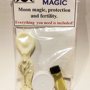 May include: A white plastic figurine of a goddess with silver detailing, a small white jar, and a small clear glass bottle with a yellow liquid inside. The packaging has the text "DO GODDESS MAGIC Moon magic, protection and fertility. Everything you need is included!"