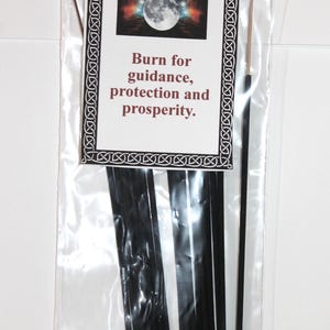 May include: A package of black cinnamon incense sticks with a label that reads "Cinnamon" and "Burn for guidance, protection and prosperity."