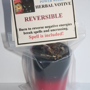 May include: A black and red votive candle in a clear plastic bag. The candle has a black top that fades into red. A label reads "POWER WITHIN HERBAL VOTIVE REVERSIBLE" with instructions to reverse negative energies. The spell is included.