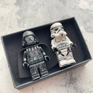 Sci-fi character cufflinks: plastic toy figures