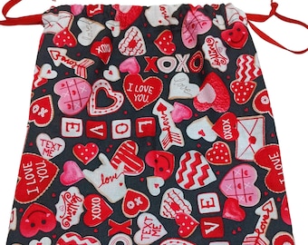 Drawstring gift bags, hearts, love, signs, arrows in pink, red on black background set of 4 bags