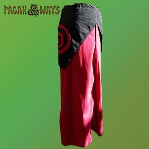 May include: A red and black garment with a circular design. The garment has a black top with a red circular design and a long, flowing red bottom. The text "Pagan Ways" is in the upper left corner.