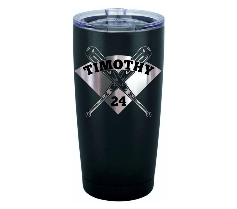 May include: Black stainless steel tumbler with a silver diamond-shaped design featuring two crossed baseball bats and the text "TIMOTHY 24".