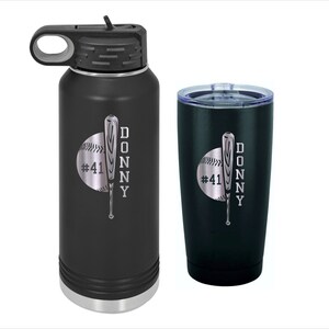May include: A black and silver stainless steel water bottle and tumbler set with a baseball and bat design. The bottle has a carrying handle and a screw-on lid. The tumbler has a lid with a straw hole. Both items are engraved with the text "#41 DONNY".