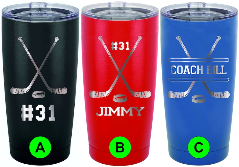 May include: Three insulated tumblers in black, red, and blue. Each features a hockey-themed design with crossed hockey sticks, a puck, and personalized text. The black tumbler has "#31", the red one says "JIMMY", and the blue one reads "COACH BILL".