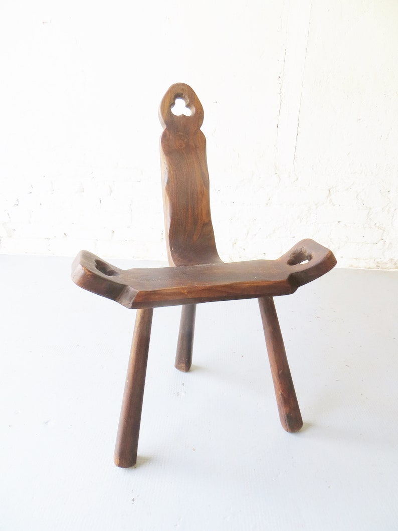 Tripod antique brutalist chair