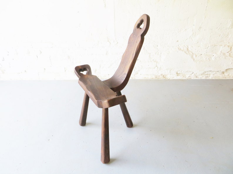 Tripod antique brutalist chair