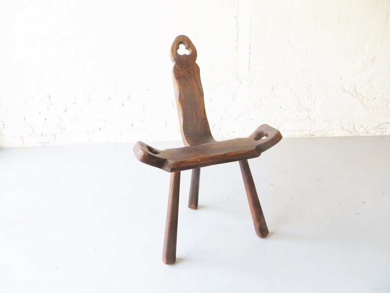 Tripod antique brutalist chair