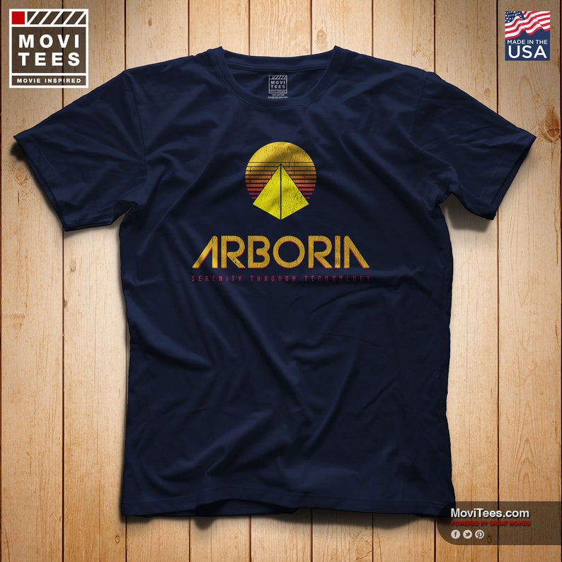 May include: A navy blue t-shirt with a retro-style graphic of a pyramid with a sun setting behind it. The text "Arboria Serenity Through Technology" is printed below the graphic.