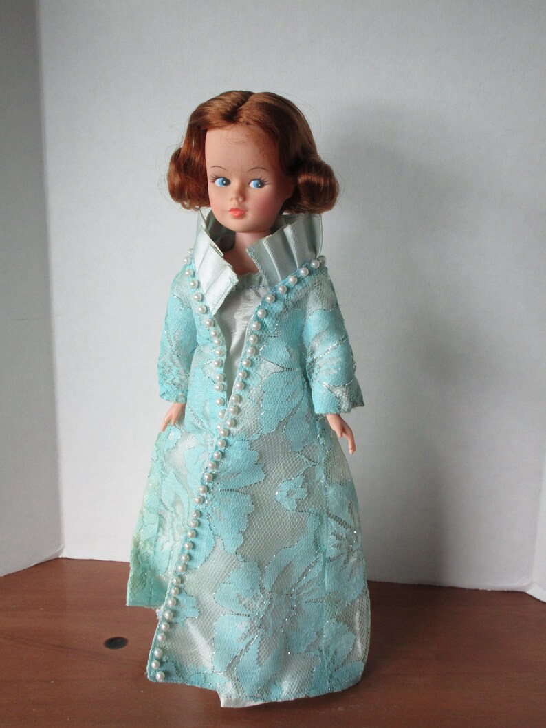 Erin Fashion Doll dressing in evening gown and coat image 1