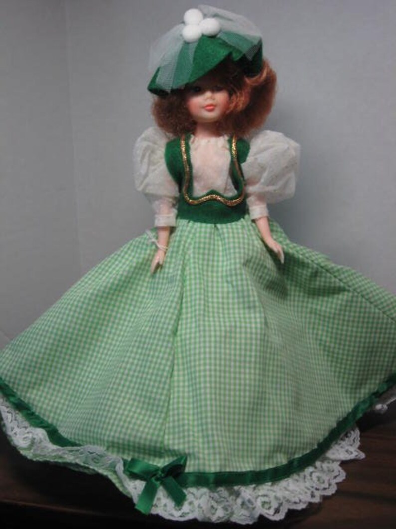 Mamie 11 inch fashion doll dressed in green gingham gown. image 0
