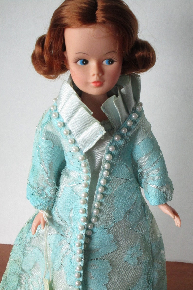 Erin Fashion Doll dressing in evening gown and coat image 0