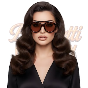 May include: A woman wearing brown tortoiseshell sunglasses with brown lenses. The sunglasses have a double bridge and a rounded shape. The woman has dark brown wavy hair and is wearing a black top. The background is white with the word "Boretti" in a gold script.
