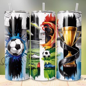 May include: Three sublimation tumblers with a soccer theme. The tumblers feature a soccer ball, a trophy, and a soccer player. The background is a watercolor design with splashes of blue, red, and green.
