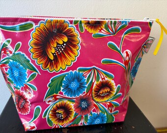 Fushia Bloom Oilcloth makeup, toiletry, sunscreen waterproof zip bag.