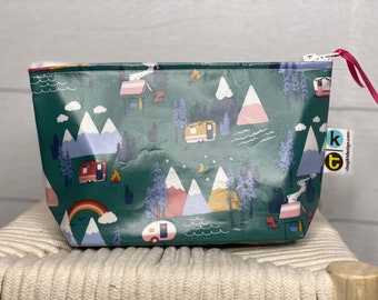 Mountain and camper oilcloth and laminated cotton make up, toiletry, pencil sunscreen zip bag.