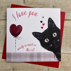 May include: A square greeting card with a red envelope. The card features a black cat peeking from the right, a heart-shaped balloon, and the text "I love you nearly as much as the cat" in red script. Small red hearts are scattered around.